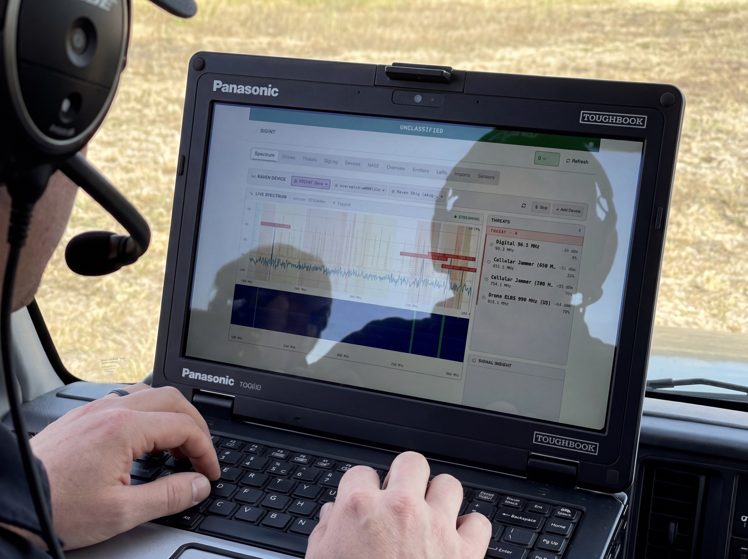 An operator running SEIDR spectrum analysis on a ruggedized laptop