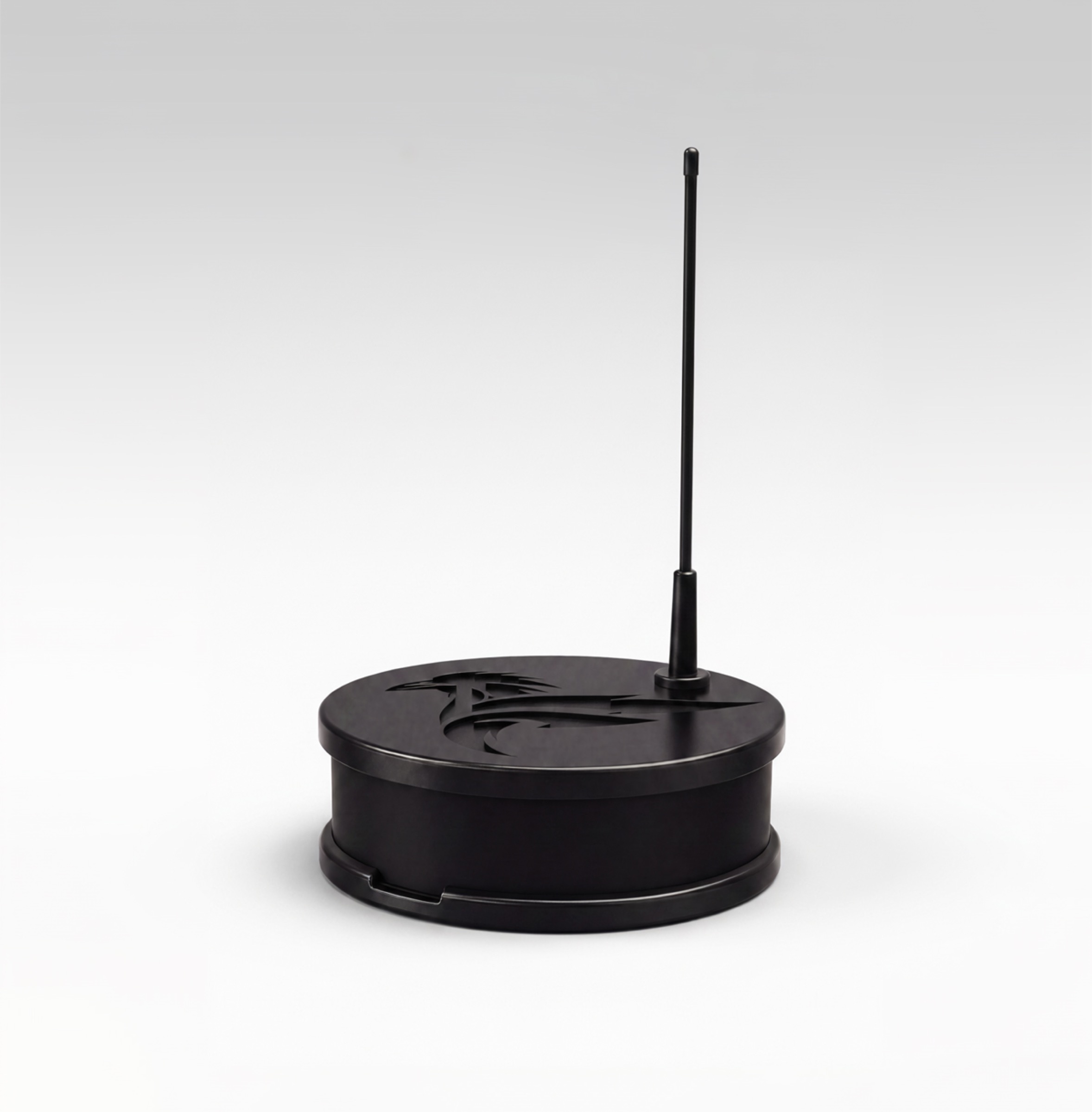 Raven Edge, a matte black disc-shaped device with a whip antenna